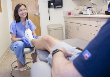 Dr. Dinh with a foot reconstruction patient