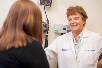 A BIDMC doctor talks with a patient about lupus.