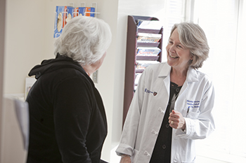 BIDMC Pain MD Christine Peeters Asodourian consults with a patient.