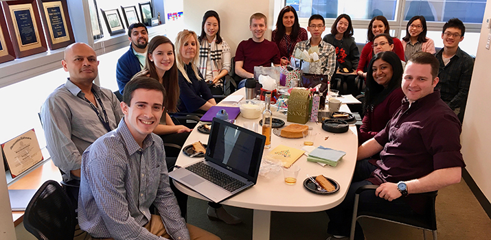 Slack Lab team members gathered around a table