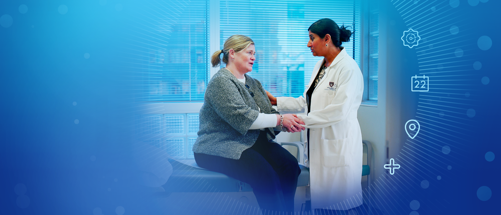 mature woman speaking with female doctor
