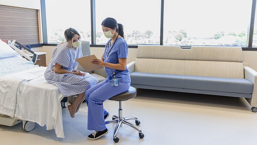 Female doctor with female patient