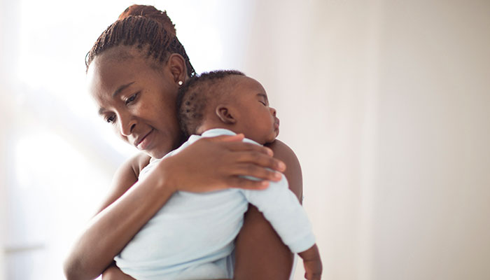 Does daylight savings time affect infant sleep? Mother Holding Sleeping Infant