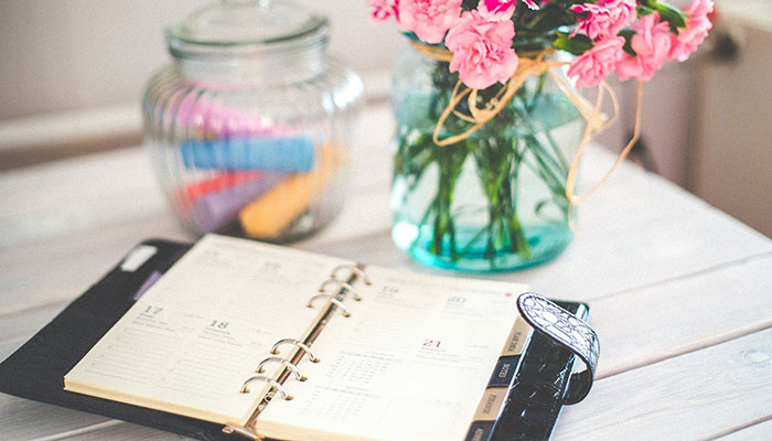 Calendar Planner and Vase of Flowers