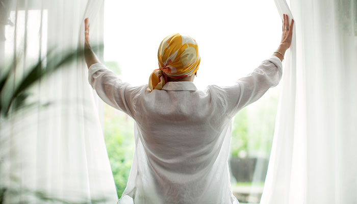 Cancer patient looking out window