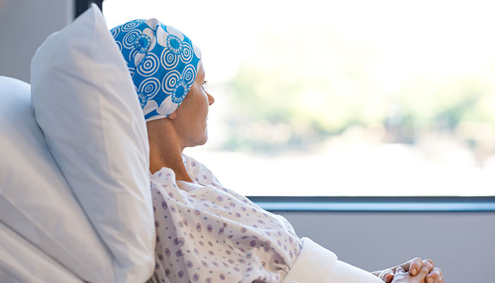 Cancer patient looks out window