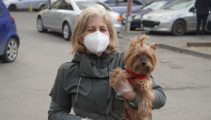 Woman with Face Mask with Dog During COVID-19