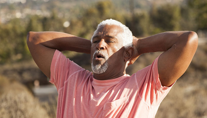 Senior Black Man Taking Deep Breath