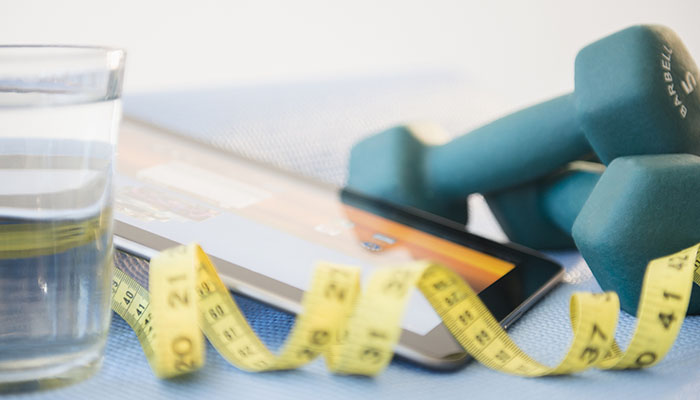 Dumbbells, Tape Measure and Water