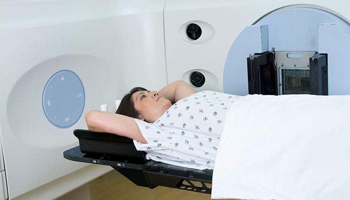 Female breast cancer patient receives radiation treatment