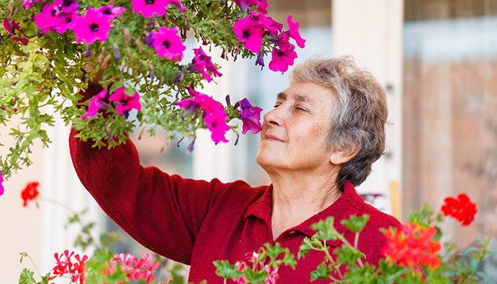 Woman Smelling Flowers