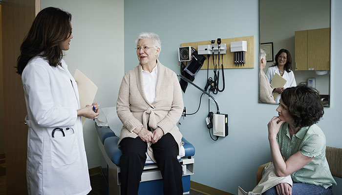 Senior cancer patient with her oncologist