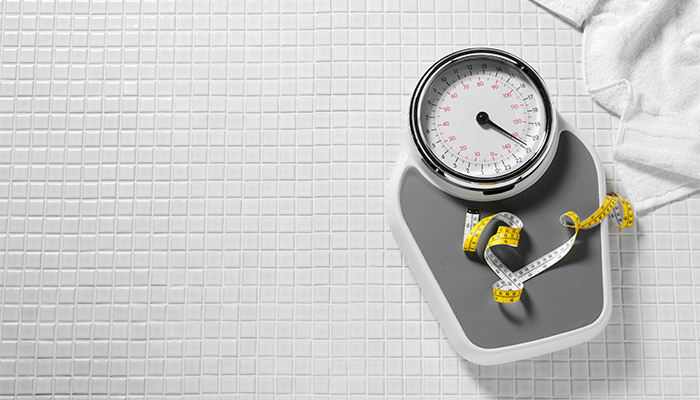 Weight scale on a bathroom floor