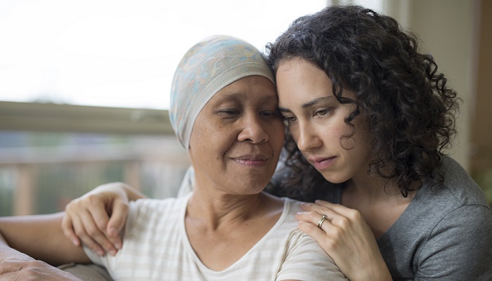 Breast cancer survivor gets hug from daughter