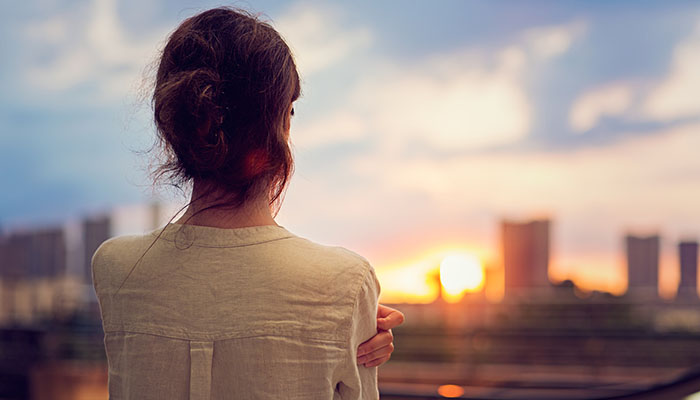 Pensive Woman Watching Sunset