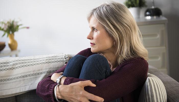 Woman with feelings of cancer survivor guilt