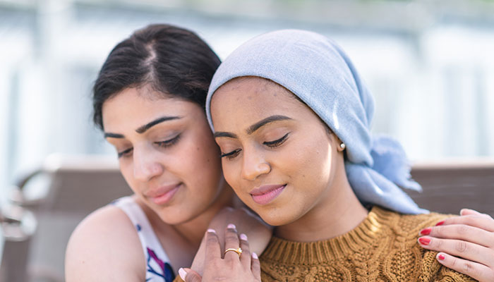 Young female cancer patient with her sister      