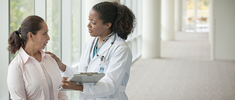 woman talking with her female doctor