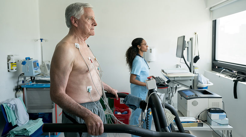 older man undergoing treadmill stress test