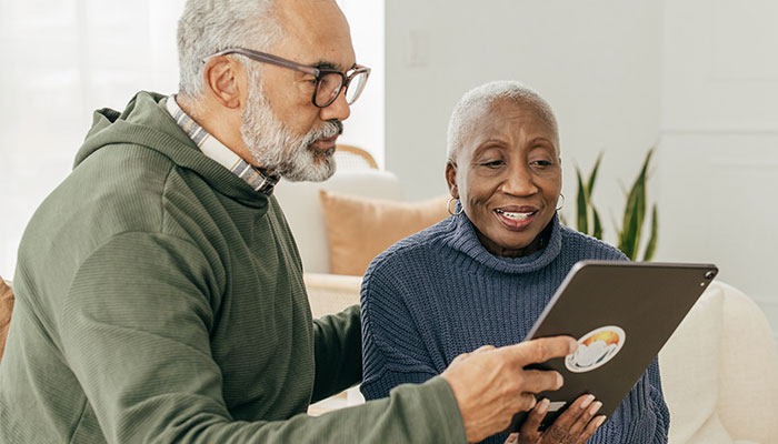 Couple looking at a tablet