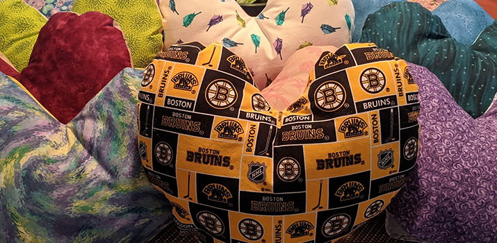 Custom Heart pillows made by Stephanie Harriston-Diggs, Rene Taber, Carolyn Fasoli, Laura Dill, and Rosemary Dill