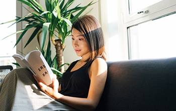 Woman reading on couch