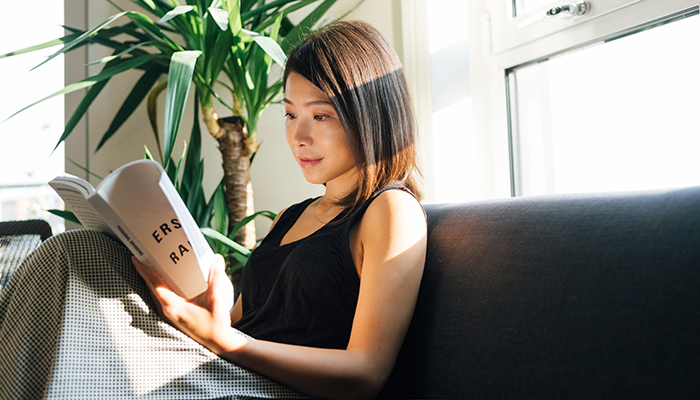 Woman reading on couch