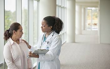 woman talking with doctor