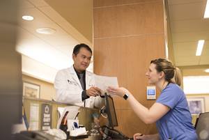 Doctor talking with nurse