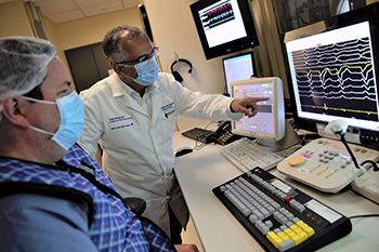 Dr. Andre d'Avila and Bill Burke of BIDMC reviewing a cardiac electrophysiology case.