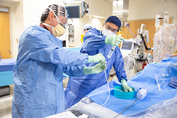 Structural Heart surgeons Dr. Liu and Dr. Chu prepare for a valve repair procedure