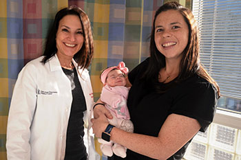 BIDMC's Dr. Loryn Feinberg with a female cardiovascular patient and her baby.