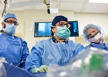 Dr. Poulin and colleagues performing a PFO closure procedure