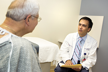 BIDMC's Pablo Quintero, MD with a patient BIDMC's Pablo Quintero, MD with a patient