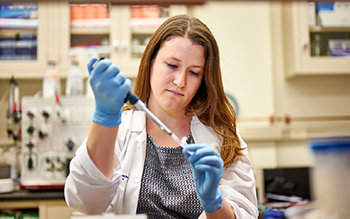 Dr. Therrien performing an assay Dr. Therrien performing an assay