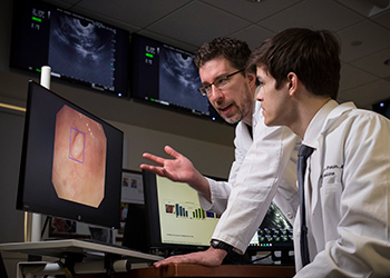 Dr. Berzin reviews imaging with a fellow