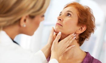 Endocrinologist examining patient