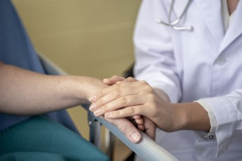 BIDMC doctor comforting a patient