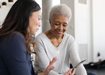 Dystonia specialist discussing treatment options with patient.