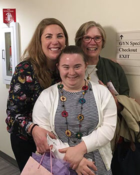 KIND Clinic's first patient poses with OB/GYN provider.