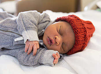 Newborn with Red Cap at BIDMC