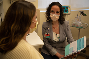 Dr Spiel attends to patient Dr Spiel attends to patient