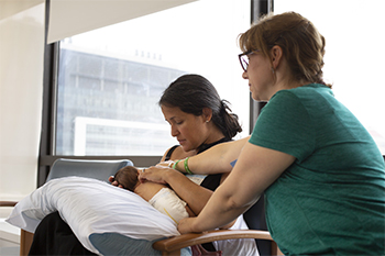 A mother and her newborn baby at BIDMC at a Breastfeeding Support Group