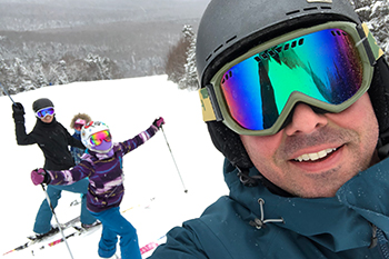 Corey Repucci skiing with daughters Annabelle and Olivia.