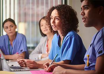 Radiology residents discuss work together