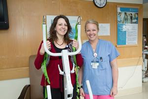 Physicians demonstrating safe patient handling equipment