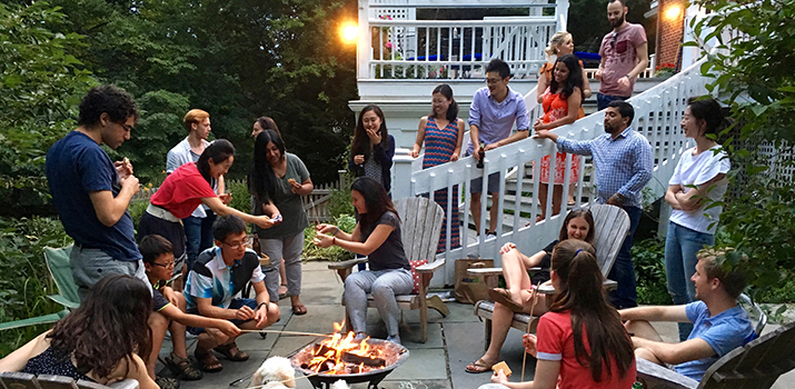 Slack Lab team members around a fire pit outside