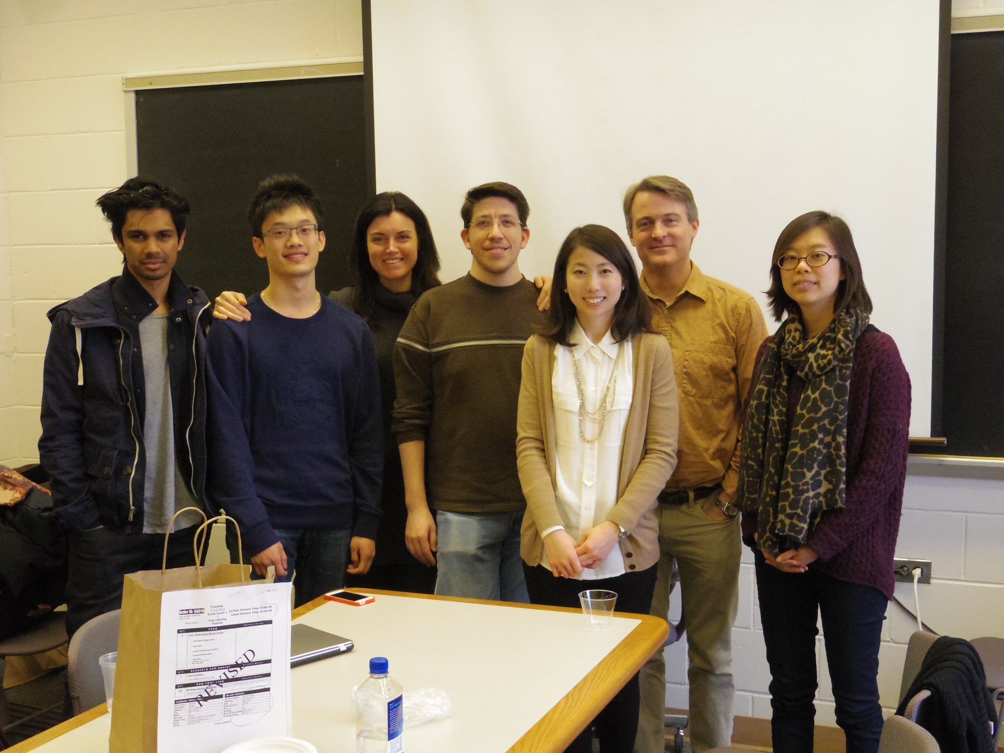 Slack Lab team members together after a thesis defense