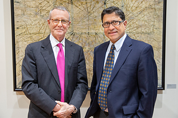 Dr. Steve Freedman and Dr. Sunil Sheth standing in front of a painting