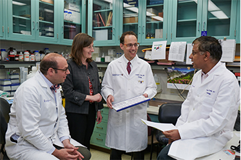 BIDMC OBGYN researchers talking in laboratory BIDMC OBGYN researchers talking in laboratory